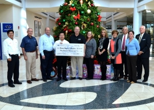 HMMA President and CEO Gui Ill Chun presents a check for 300,000 to representatives from United Way offices throughout the River Region. This is the seventh year Hyundai Motor Manufacturing Alabama has organized a United Way campaign. HMMA President and CEO Gui Ill Chun presents a check for 300,000 to representatives from United Way offices throughout the River Region. This is the seventh year Hyundai Motor Manufacturing Alabama has organized a United Way campaign.