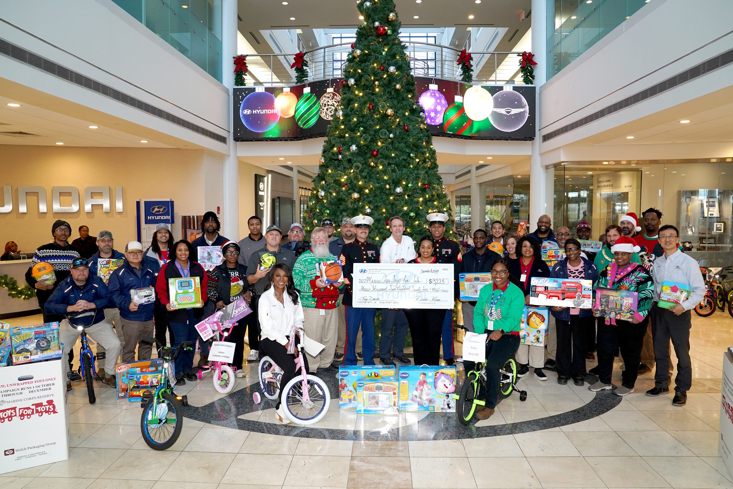 HMMA TEAM MEMBERS DONATE BICYCLES, TOYS, AND FUNDS TO MARINE CORPS TOYS FOR TOTS