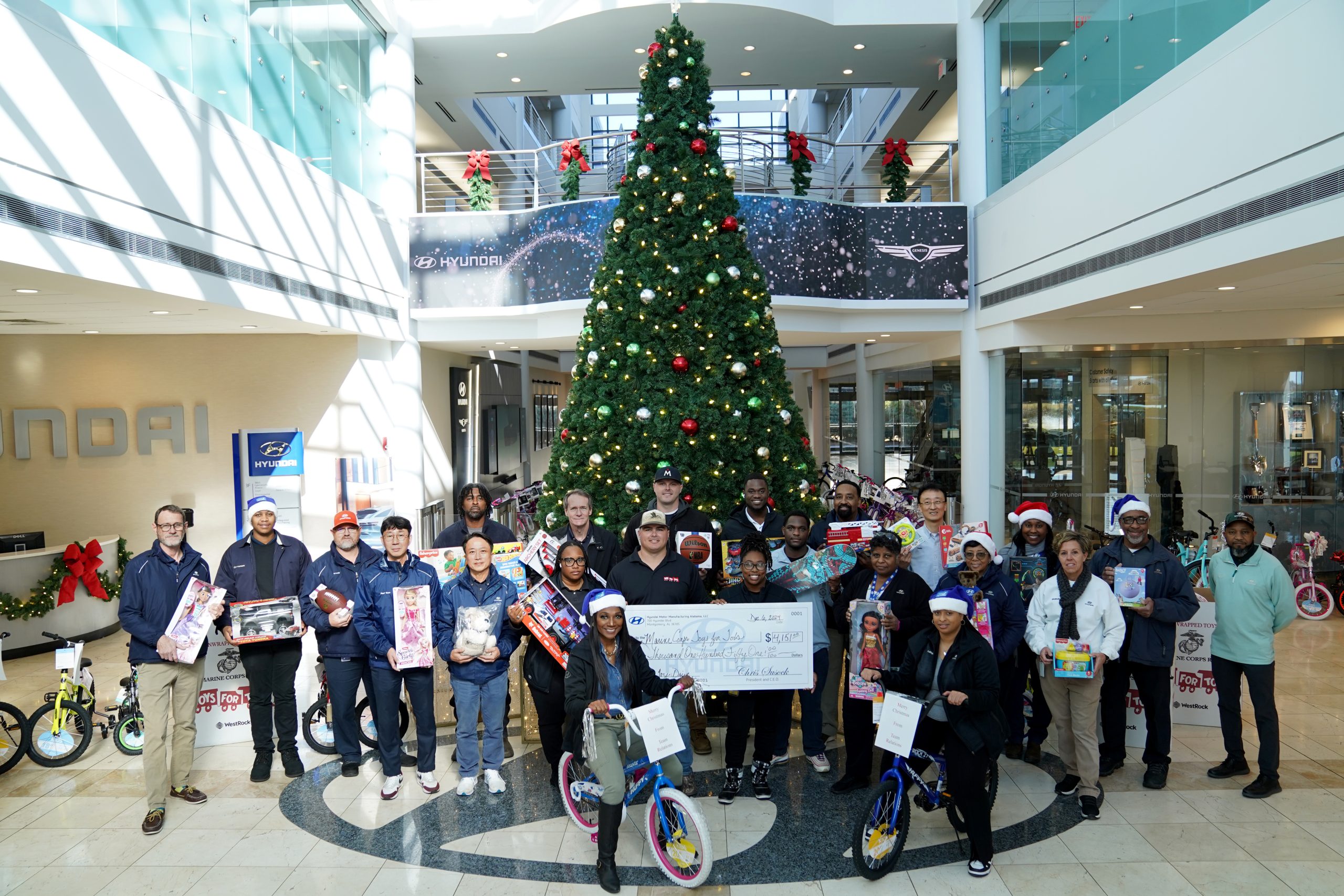 HMMA TEAM MEMBERS DONATE BICYCLES, TOYS, AND FUNDS TO MARINE CORPS TOYS FOR TOTS