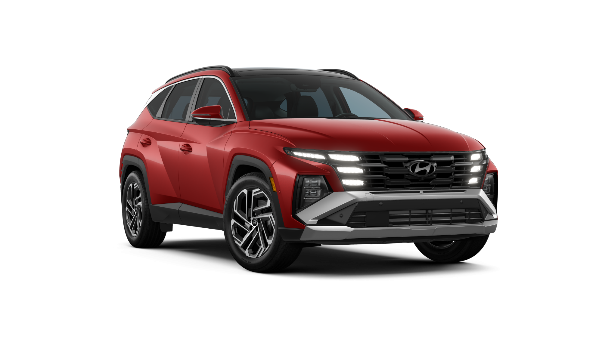 2025_Tucson_LTD_AWD_UltimateRed_Black_FrontPassAngleWheelTurnDrlOn_WhiteStudio
